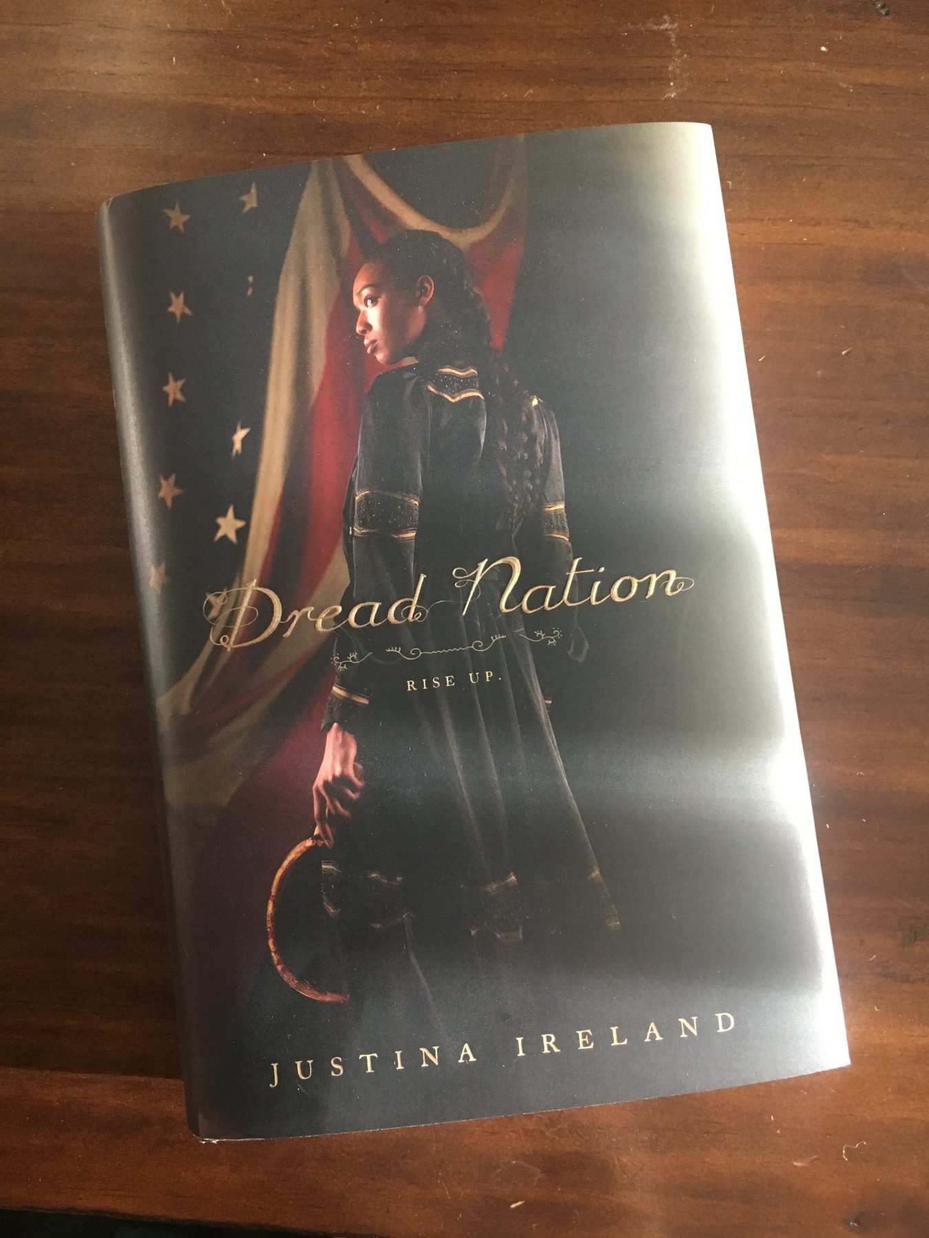Hardcover of Justina Ireland's novel Dread Nation on a wooden desk
