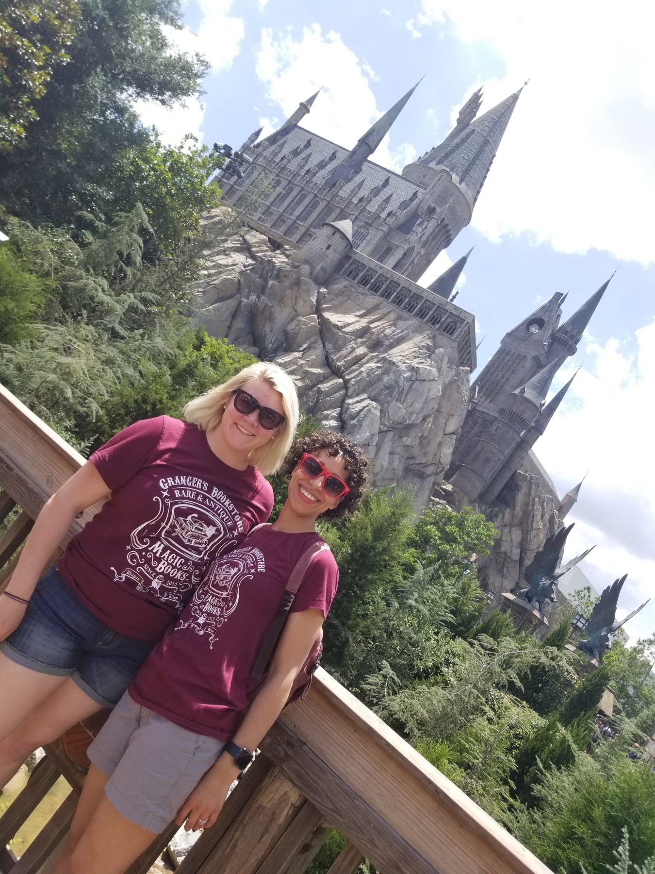 J & K in matching t-shirts in front of Hogwarts Castle